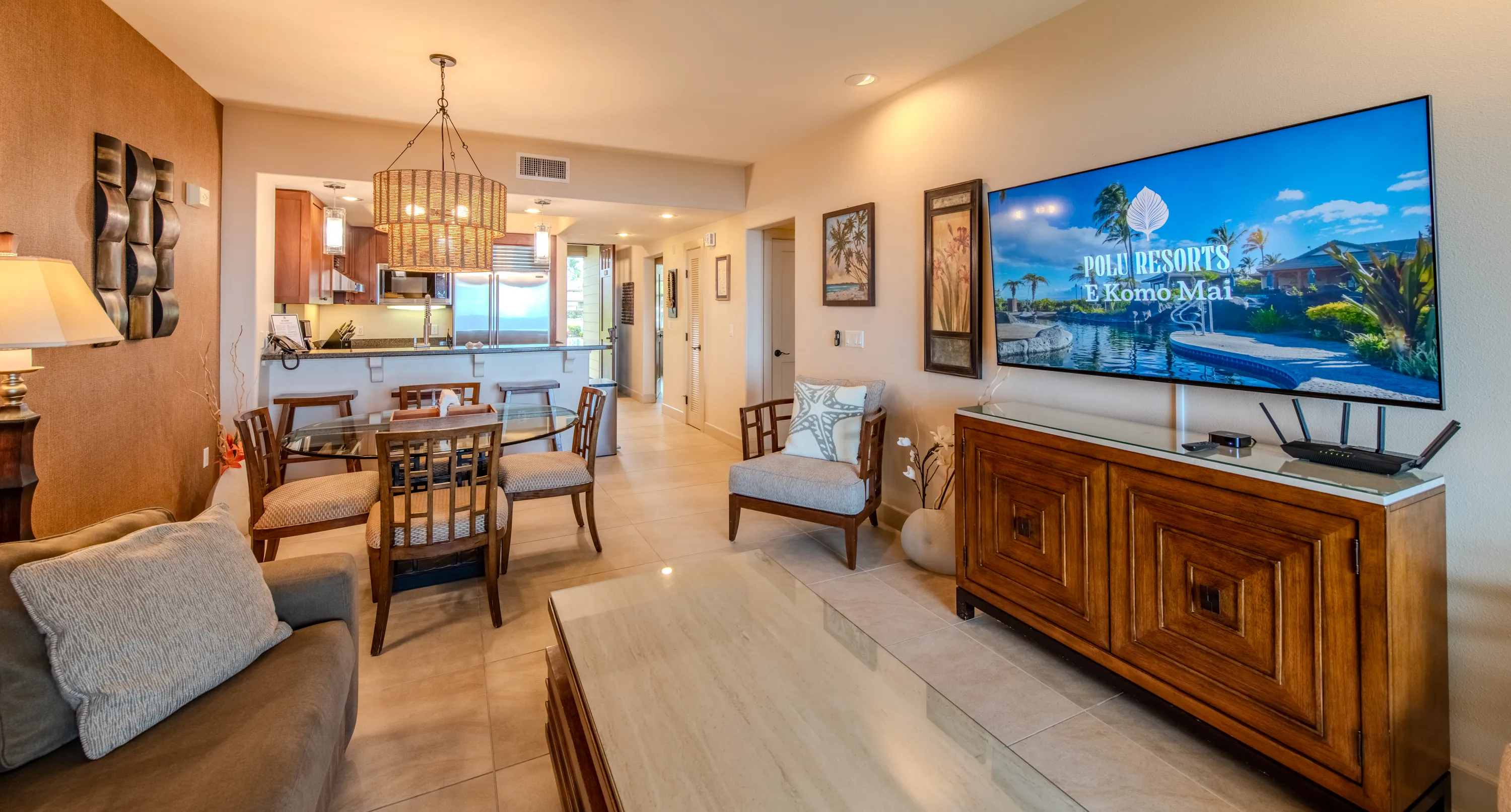 Open great room with living, dining, and kitchen under one bright ceiling