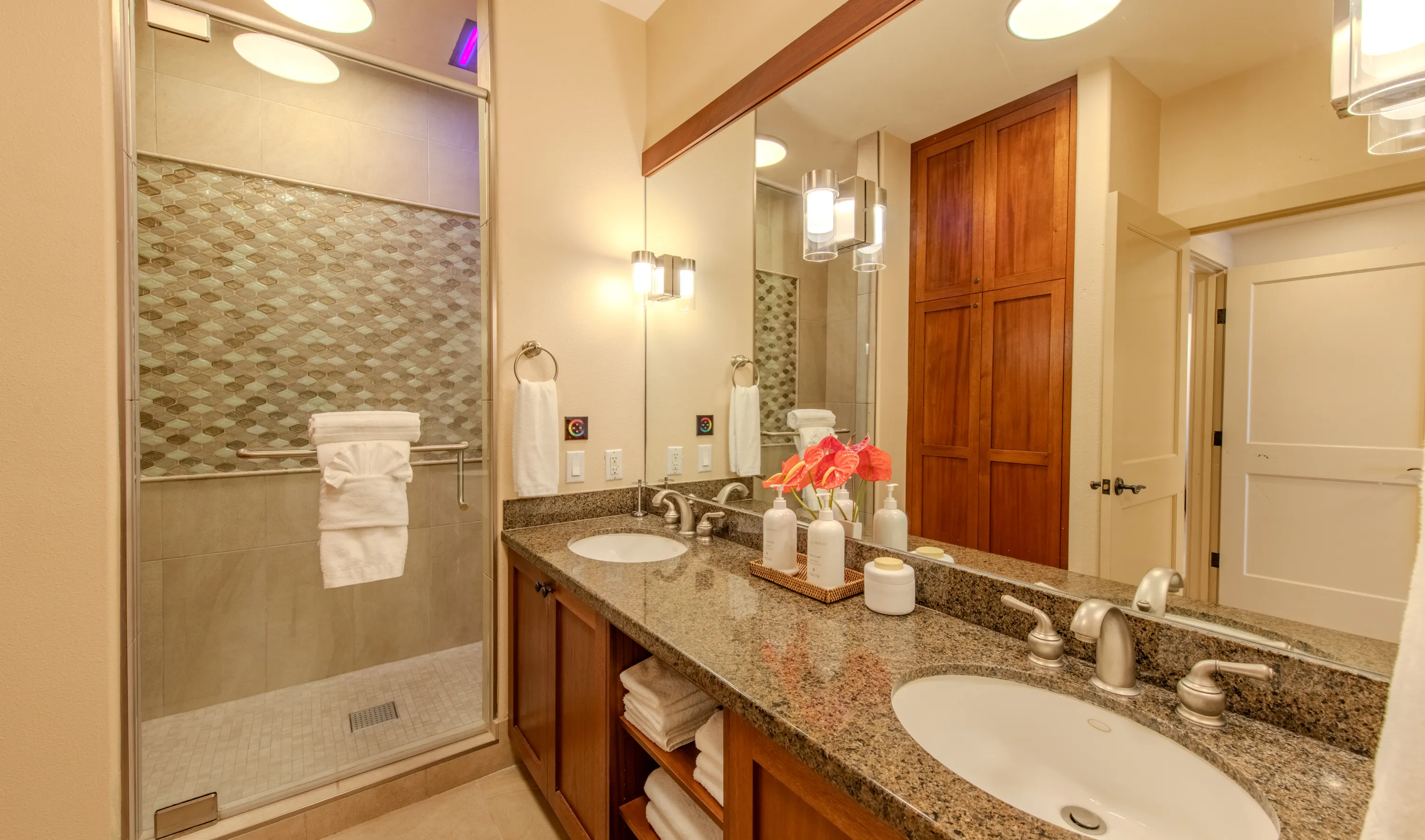 Ensuite bathroom with a double-sink granite vanity