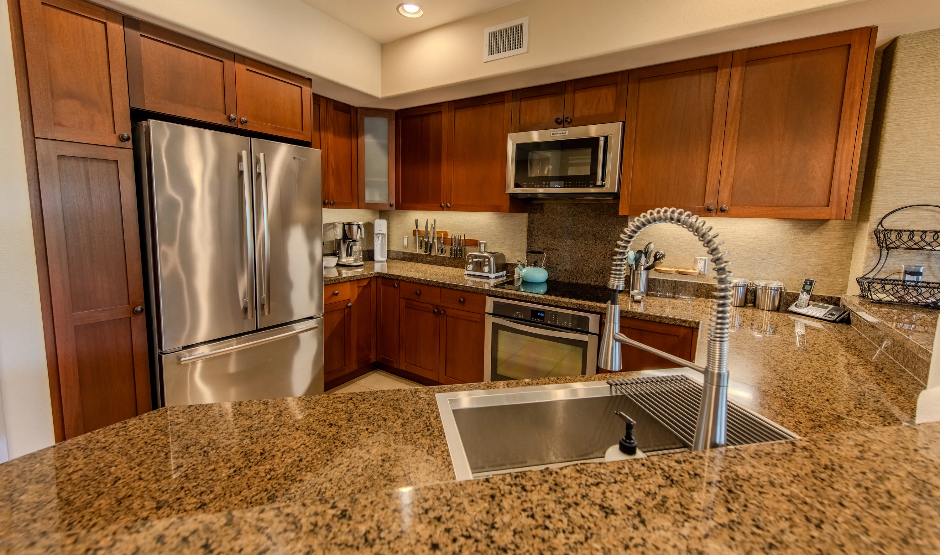 Fully equipped kitchen with granite counters and stainless steel appliances