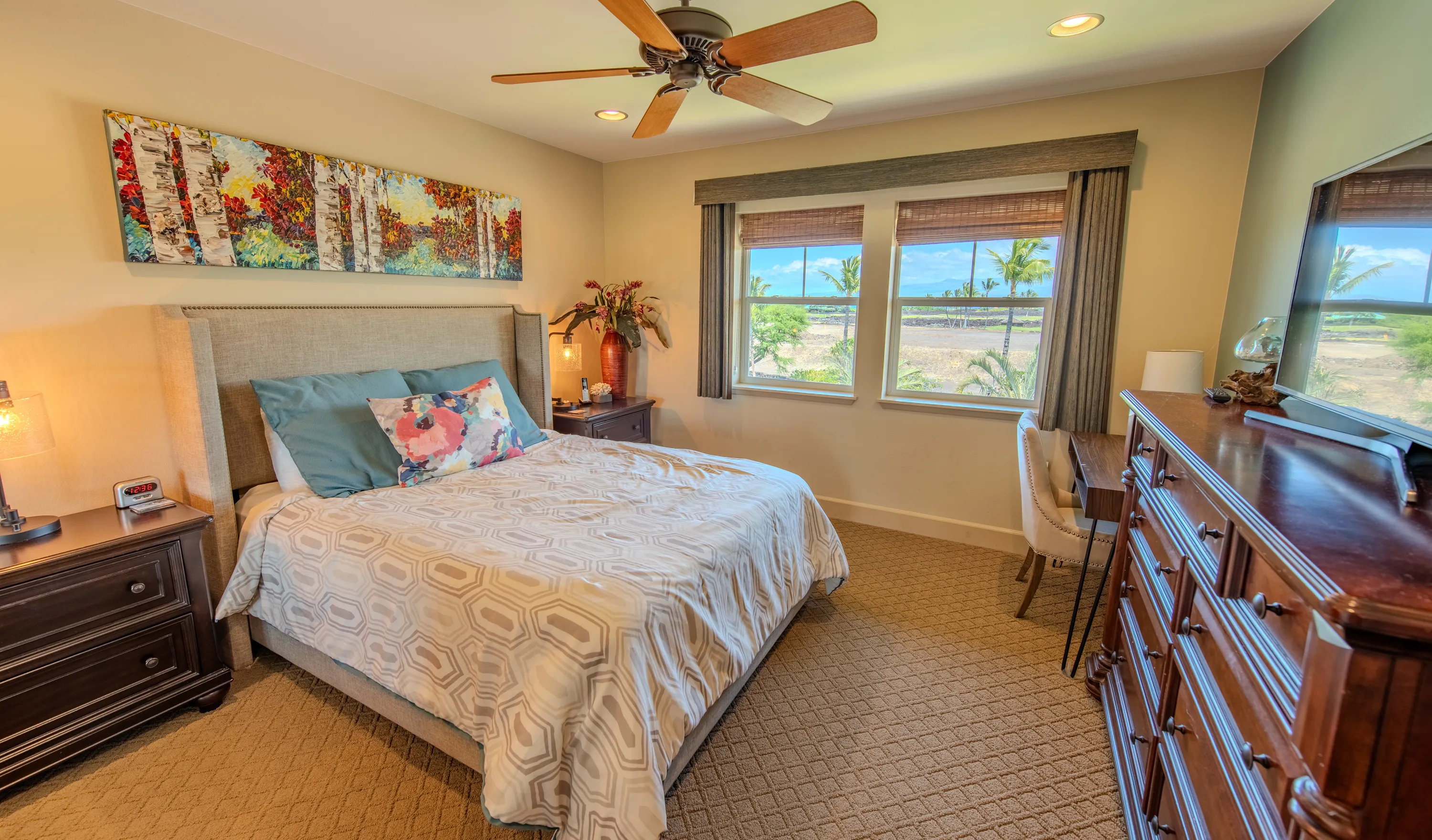 Second bedroom with a queen bed and ceiling fan