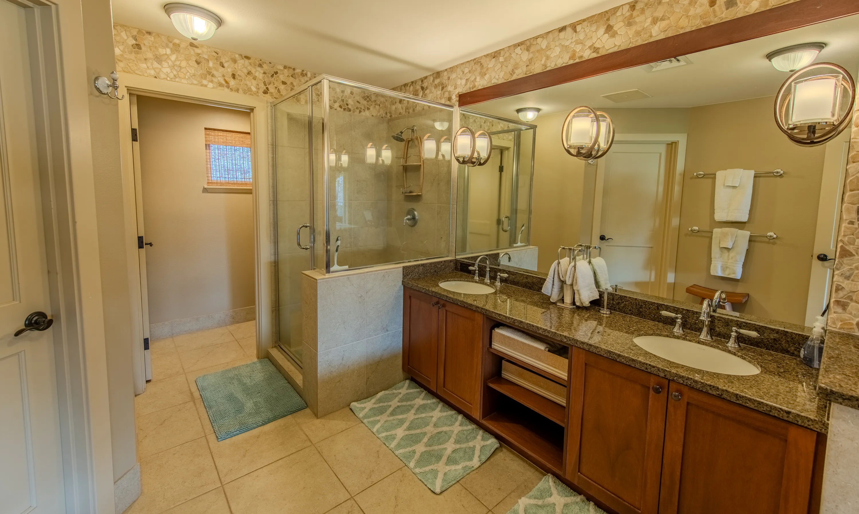 Primary bathroom with a double-sink vanity and glass walk-in shower
