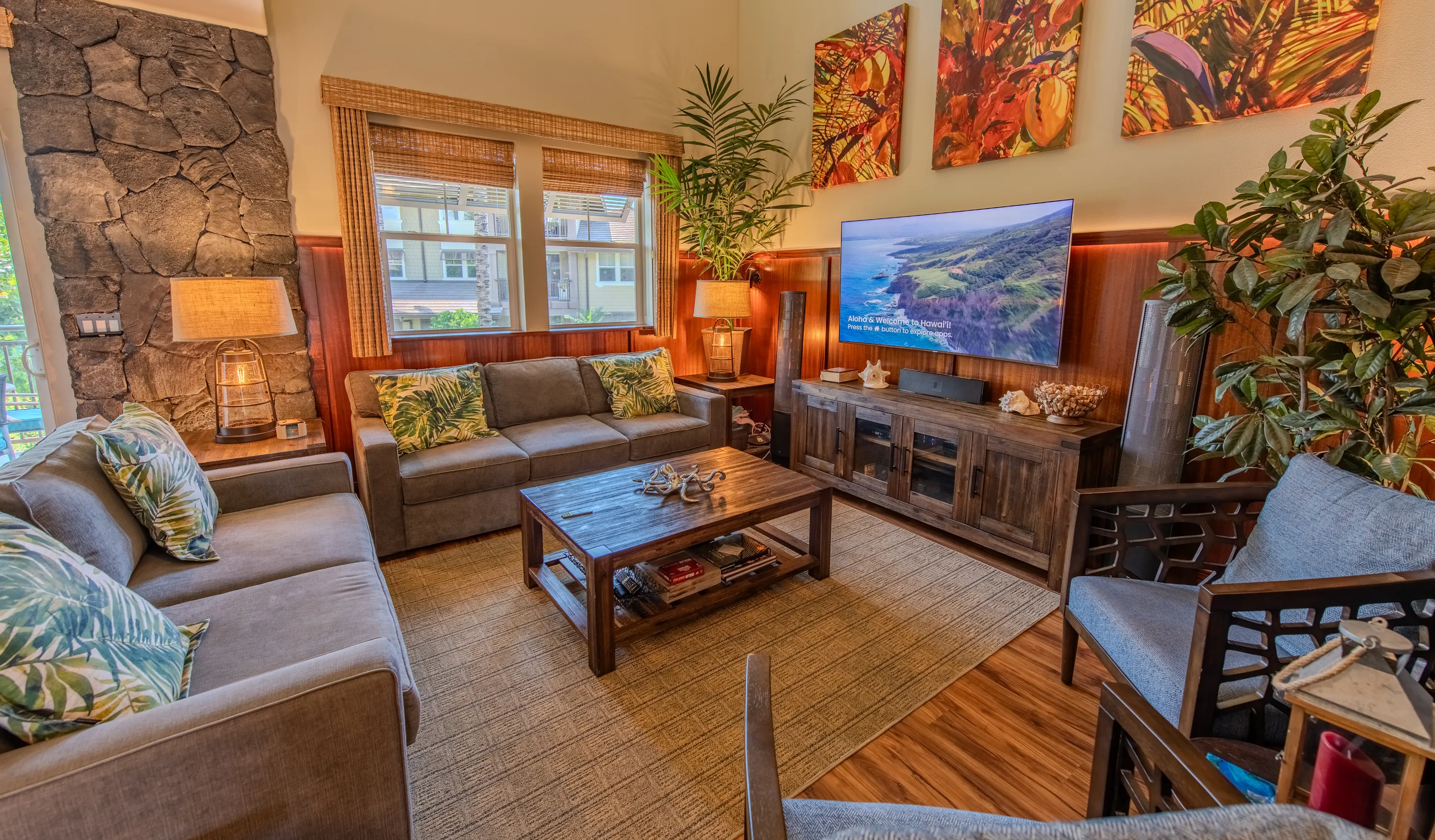 Living room with Bird of Paradise artwork and a flat-screen TV