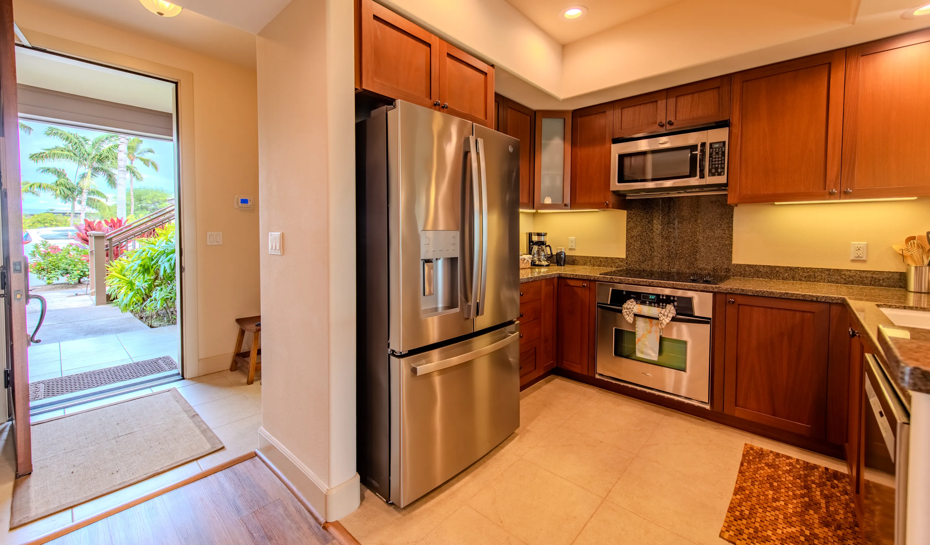 Kitchen opening to the ground-floor patio and garden
