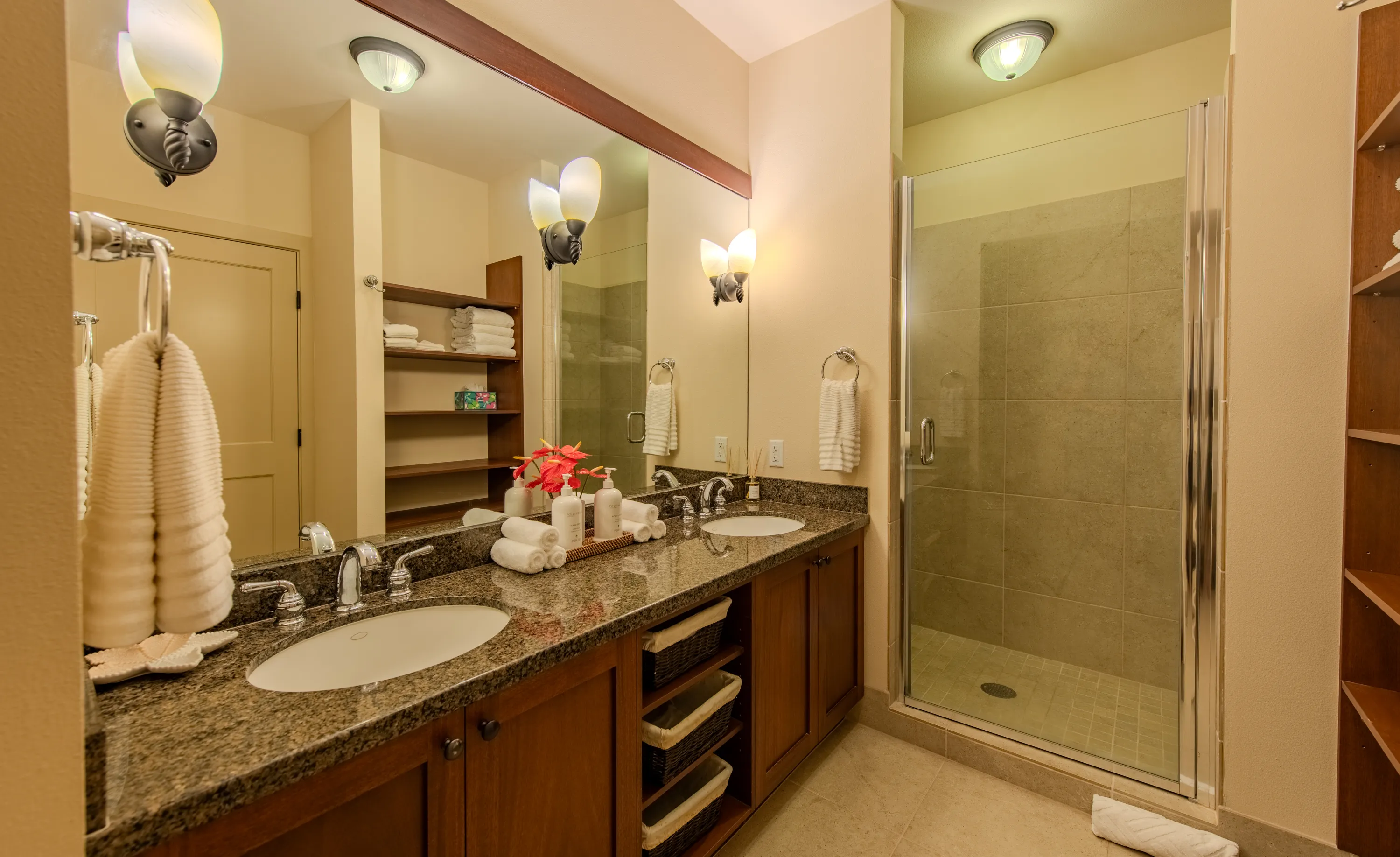 Bathroom with a double-sink vanity and glass walk-in shower