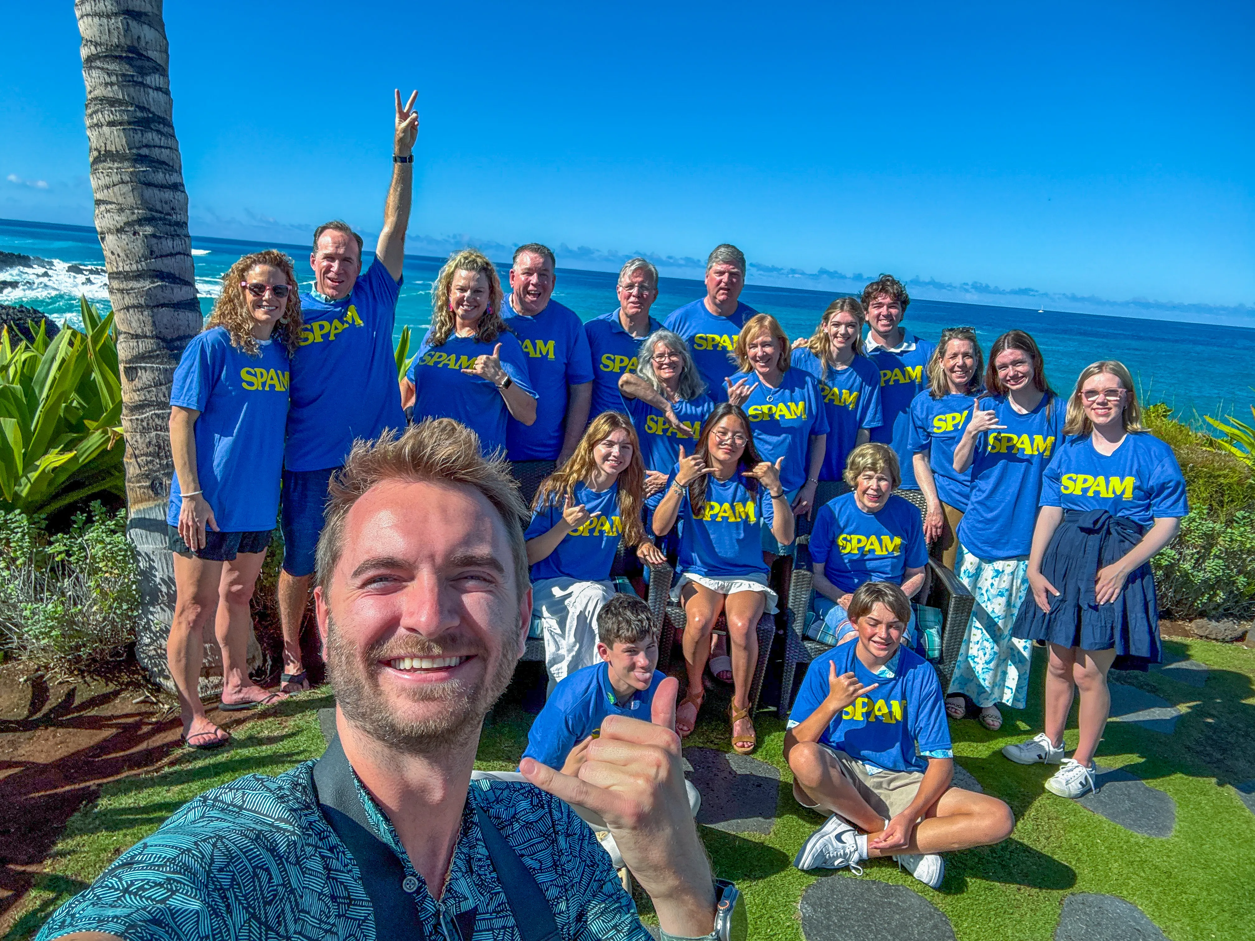 A family poses with James of Polu Resorts at Hali’i Kai, Waikoloa Beach Resort.