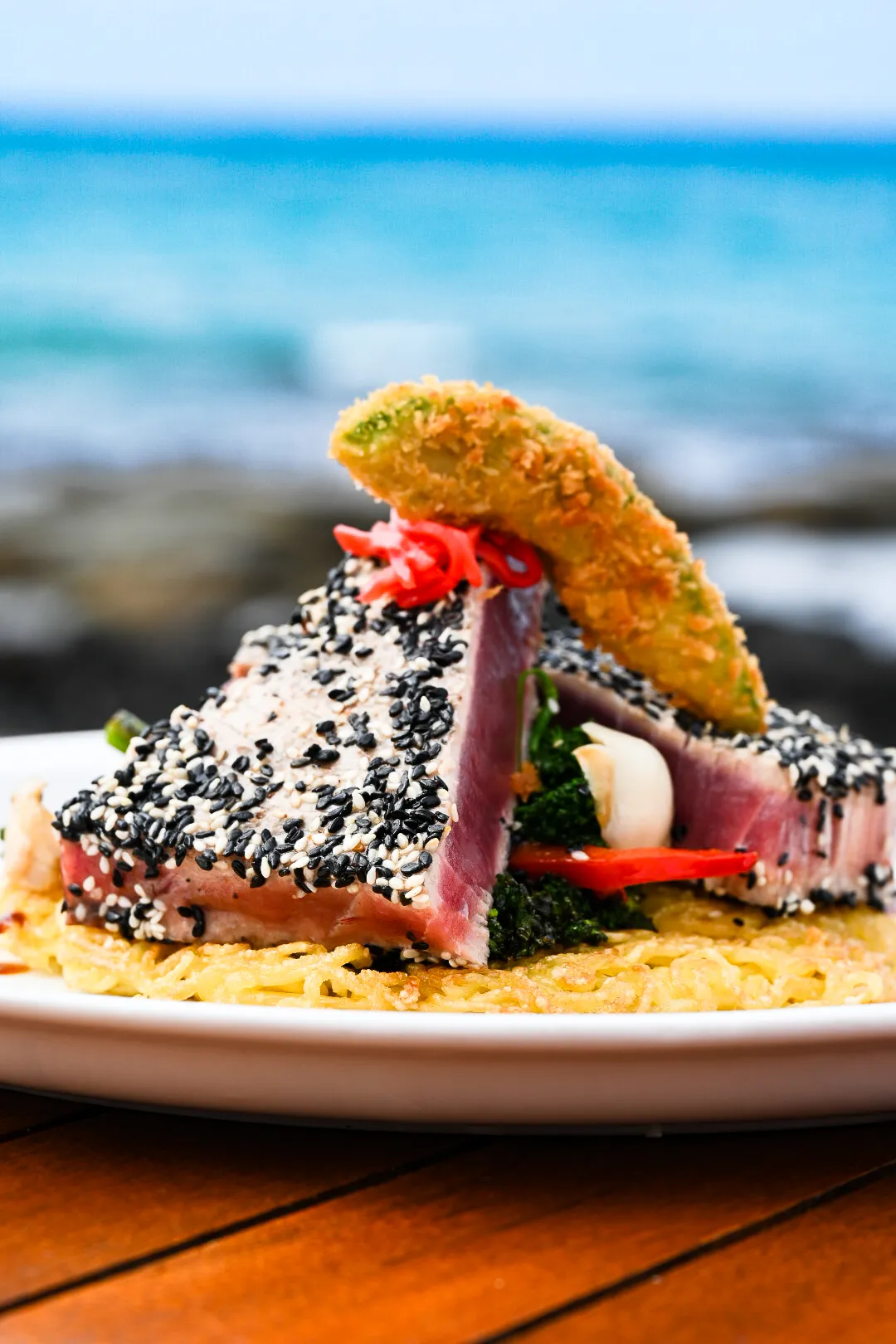 A sesame-crusted seared ahi dish plated at Lava Lava Beach Club