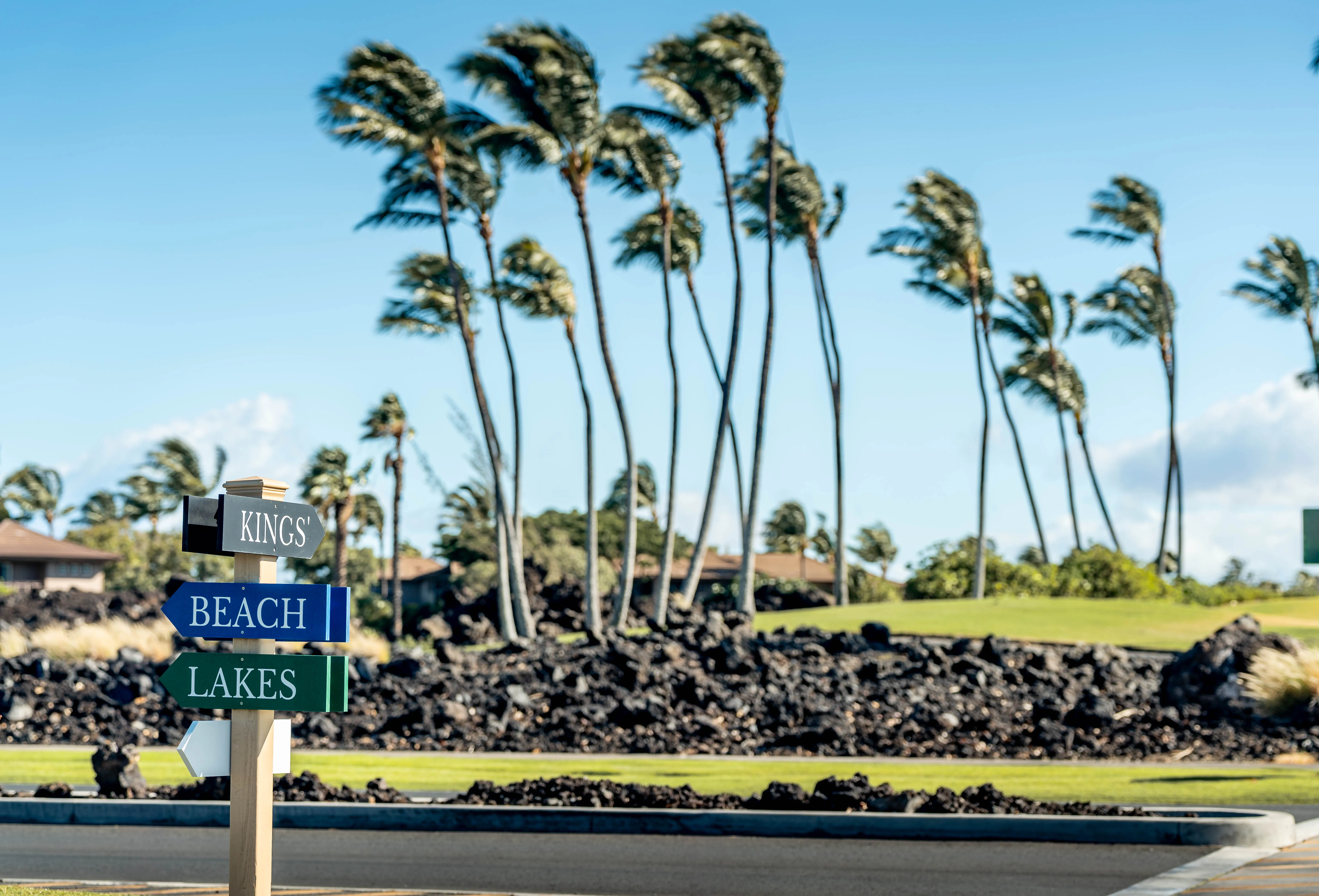 An open-air shopping and dining center at Waikoloa Beach Resort at dusk