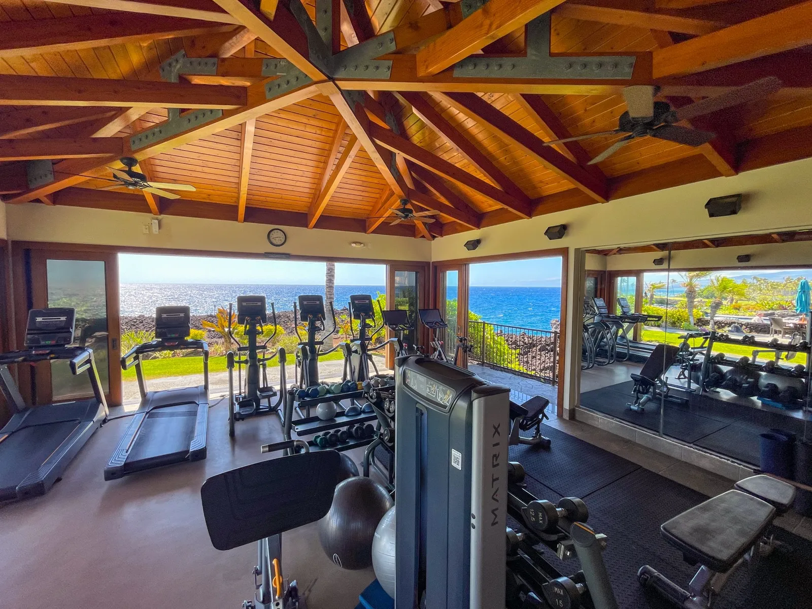 The open-air fitness hale at the Ocean Club, with exercise equipment facing the ocean